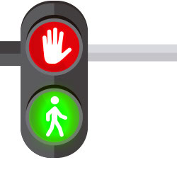 Image of a traffic light. The red indicates to stop, with a hand symbol, while the green invites pedestrians to go.