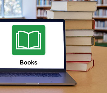 Laptop showing the Books icon in a library.