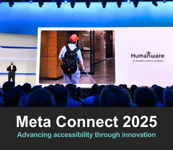 Humanware presentation at a technology event, where a speaker on stage shows a photo of a blind person entering a building with a white cane.