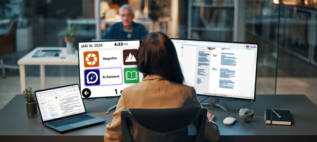 Person working at a desk using the Prodigi AI Assistant on a large monitor.