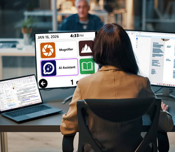 Office professional using an AI assistant on dual monitors.