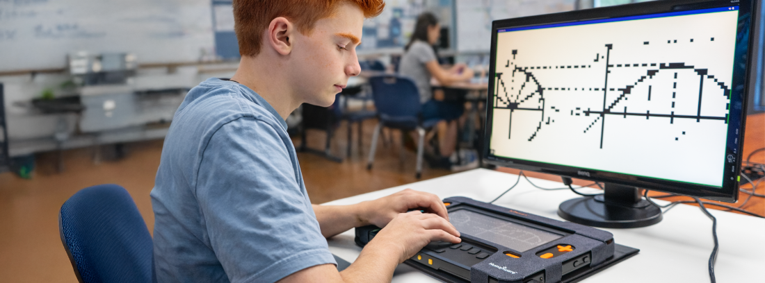 Student reads a tactile graph on a Monarch braille device connected to a screen.