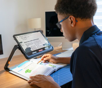 Student using an explore 12 with a stylus for studying.