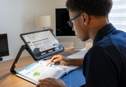 Student using an explore 12 with a stylus for studying.