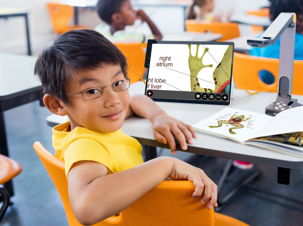 Student using assistive technology in classroom