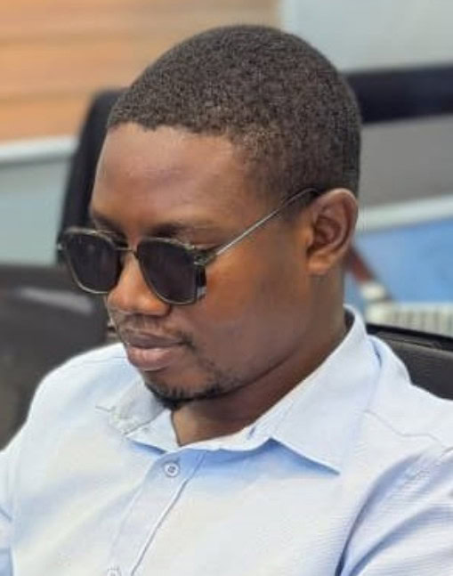 Erick Mlasani, former student turned academic through access to braille technology.